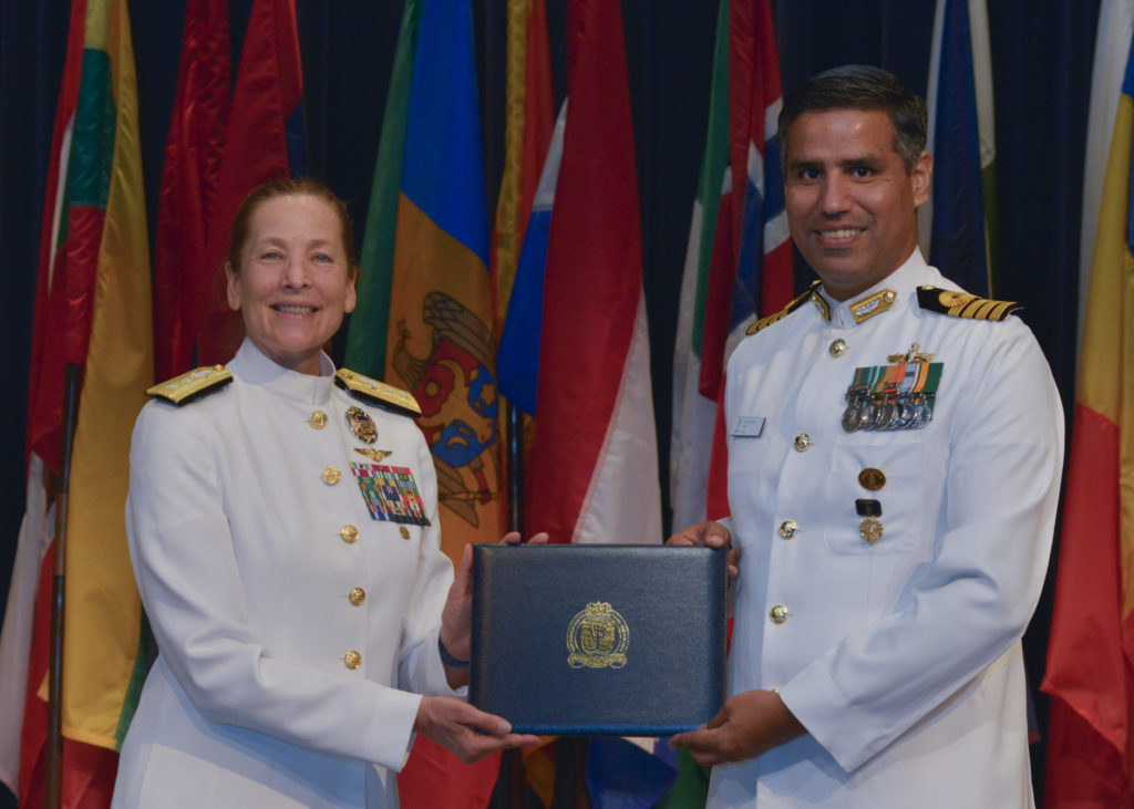 CAPT Sachin Dhir receives his diploma from RADM Chatfield